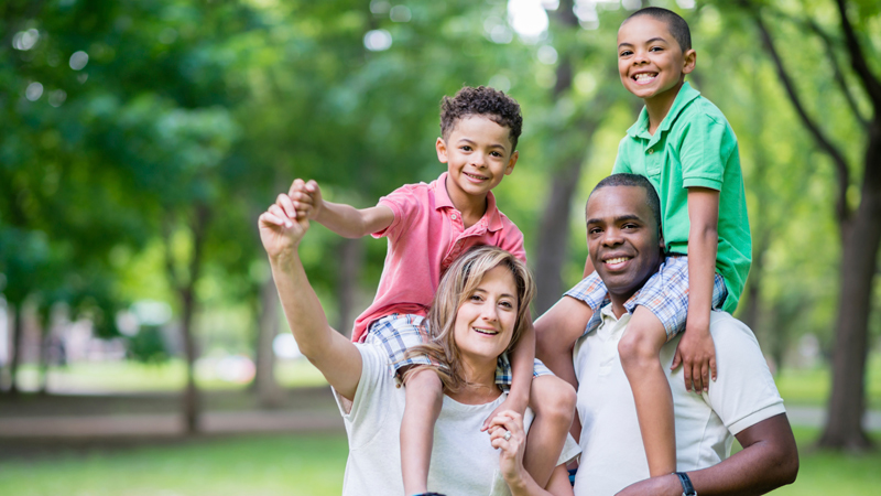 Parents with their two kids at the park
