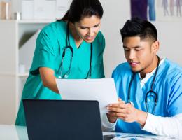 healthcare professionals looking at computer