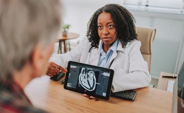 doctor with a patient in the office for a consultation