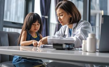 Doctor Examining a Young Patient